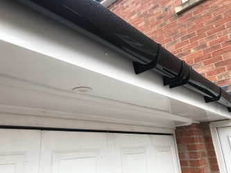 White uPVC Fascia & Soffits with Black Round guttering