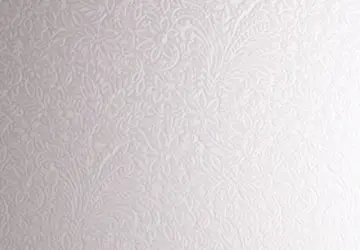 Textured white wallpaper with floral patterns covering the surface.