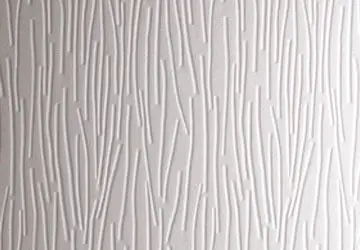 Textured wall with vertical lines and patterns resembling branches or reeds in a light color.