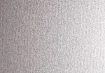 Textured light gray wall with subtle patterns.