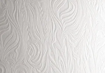 Textured white wall with swirling patterns.