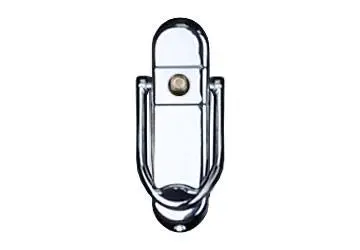 Metal door knocker with a rounded top and U-shaped handle mounted on a surface.