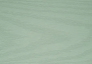 Light green textured surface with subtle lines and patterns.