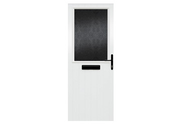 White door with a black glass panel and a black handle, featuring a mail slot at the bottom.
