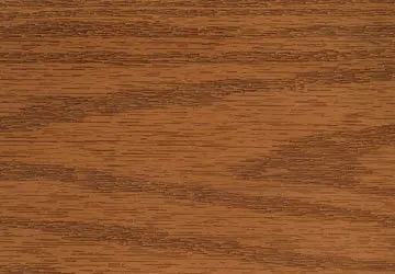 Wooden surface with a brown finish and distinct grain pattern.