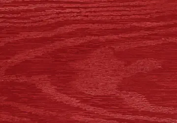 Red wooden surface with visible grain patterns.