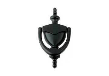 Black door knocker with an ornate design, mounted on a white background.