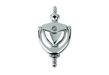 Chrome door knocker with a circular base and curved handle.