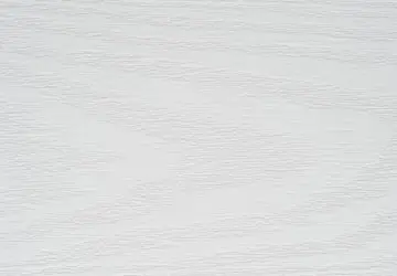 White textured surface with subtle lines.